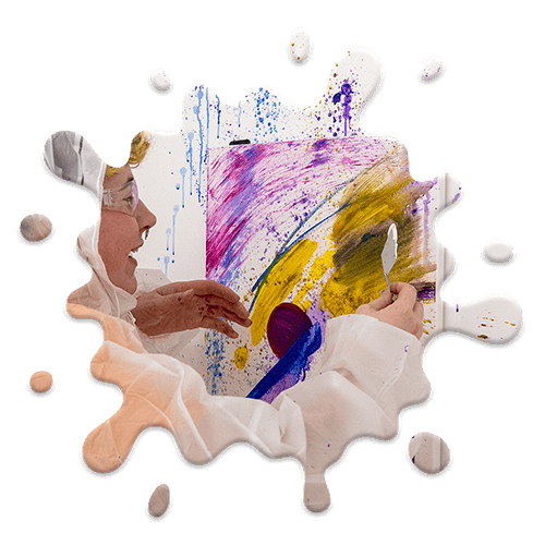 A close up image of a person painting on a canvas